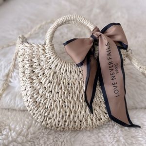 Adorable mini straw bag. Lined with drawstring for safe carry & crossbody strap